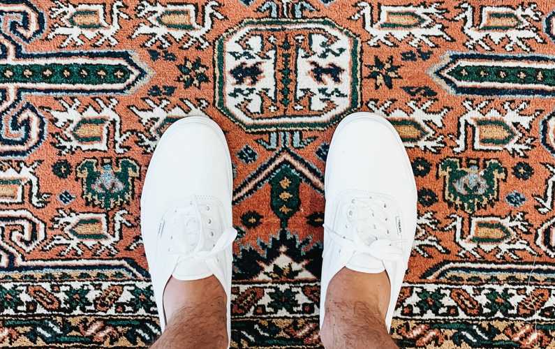 Man standing on Oriental rug